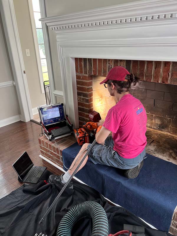 Technician performing a camera inspection